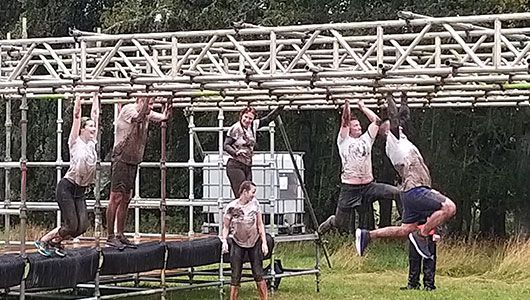 Inverness Office on monkey bars at Beast Race 2019