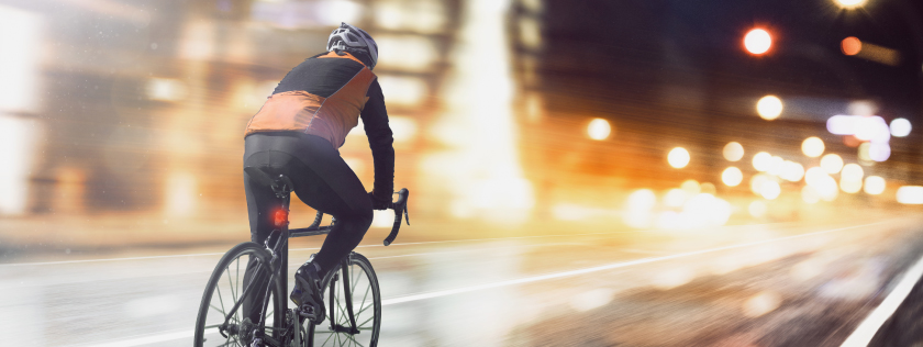 Cyclist on road at night