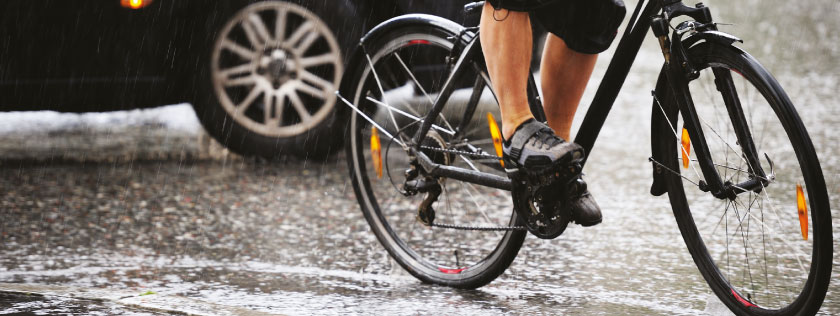 Cycling on road in the rain