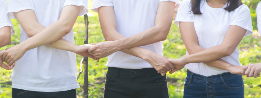 People with arms linked