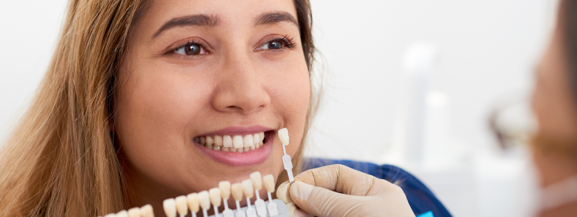 Woman loooking at gettig teeth whitening procedure