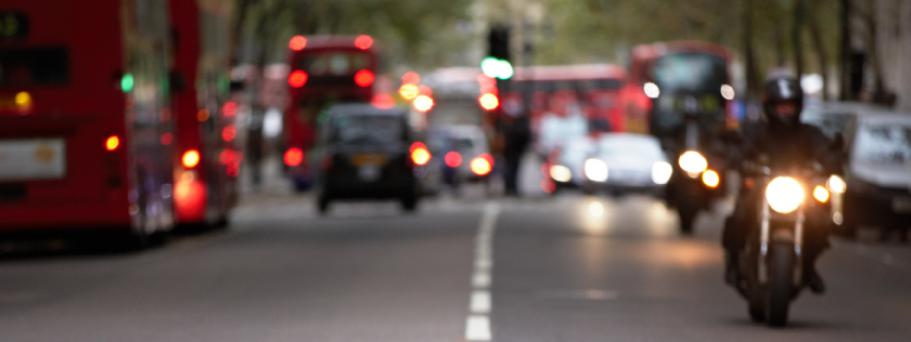 Cars, buses and motorbike traffic in town