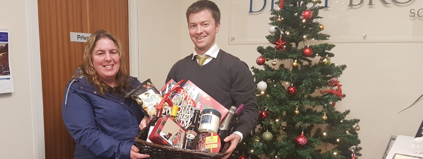 Sam Cowie presenting hamper to winner