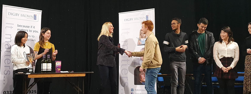 Trish giving out prizes to winners at Edinburgh Debates Union Competition 2019