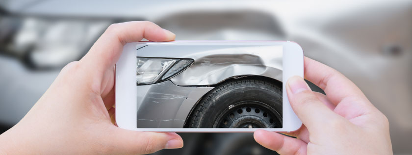 Taking photo of damaged car with smartphone