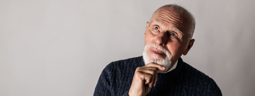Older man looking thoughtful