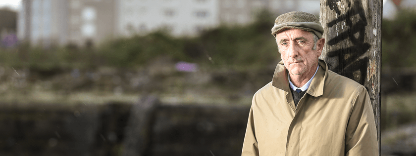 Older man looking sad