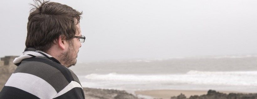 Man looking out to sea