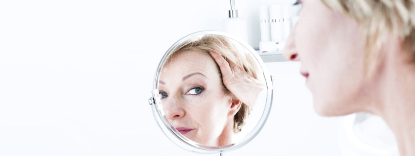 Woman looking in mirror
