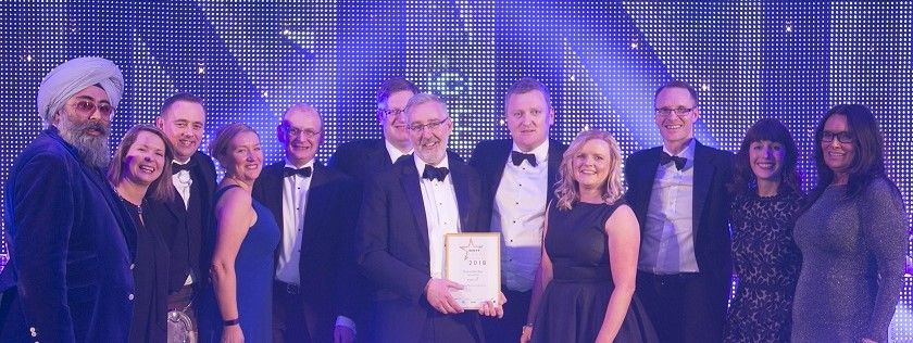 Digby Brown receiving Firm of the Year Award 2018