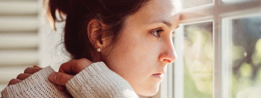 Woman looking out of window