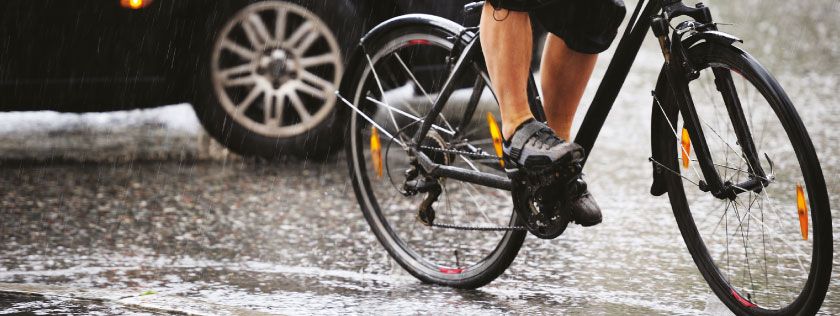 Cycling on road in the rain