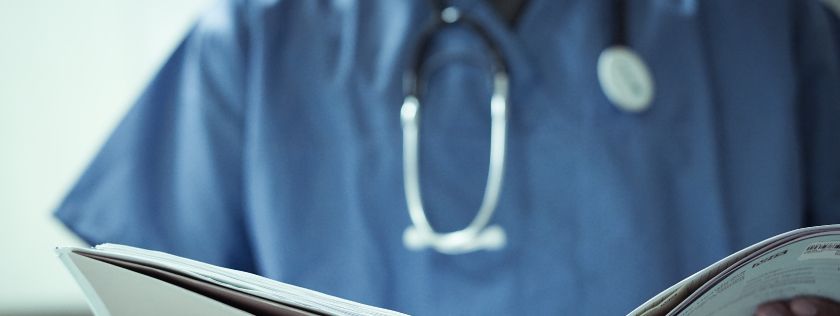 Doctor looking at notes