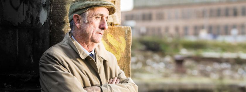 Older man looking thoughtful