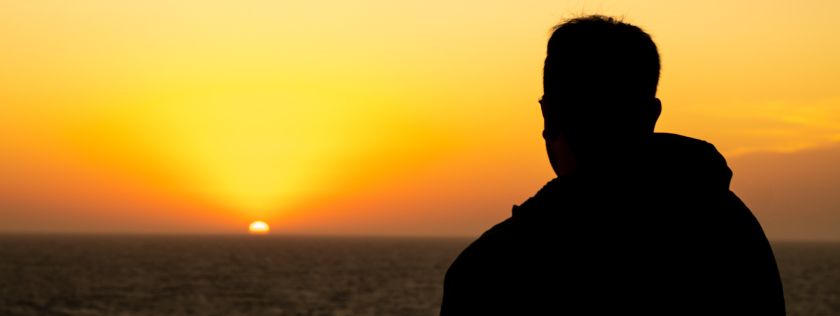 Man looking out to sea