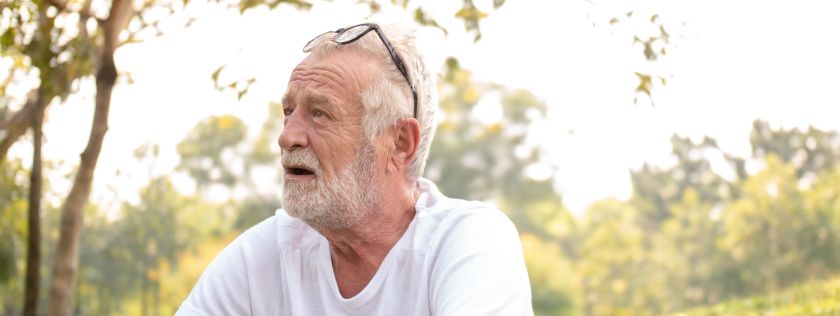 Older man sitting in the park