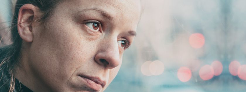 Woman looking out window