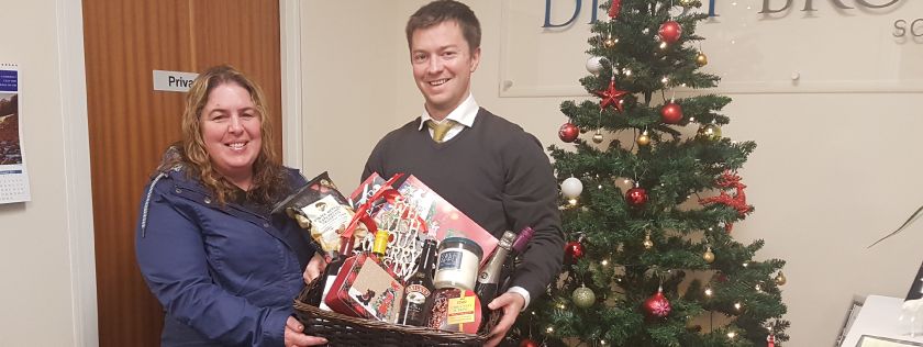 Sam Cowie presenting hamper to winner