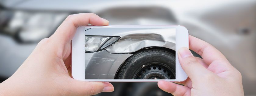 Taking photo of damaged car with smartphone