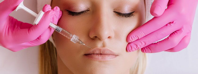 Woman getting lip filler procedure