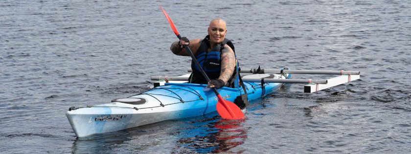 Woman using adapted kayak at Castle Semple