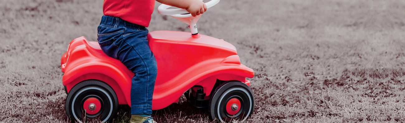 Child rising toy car