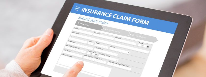 Filling out car insurance claim form