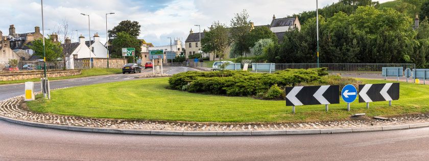 Waiting at a roundabout
