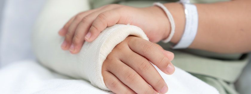 Girl with arm in cast
