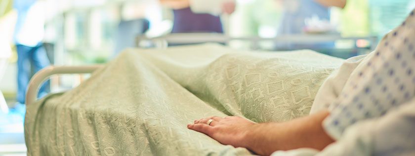 Woman in hospital bed