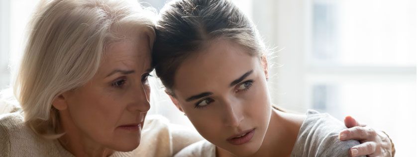 Mother and daughter looking concerned