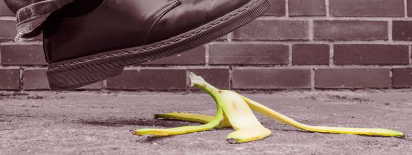 Man about to slip on banana skin