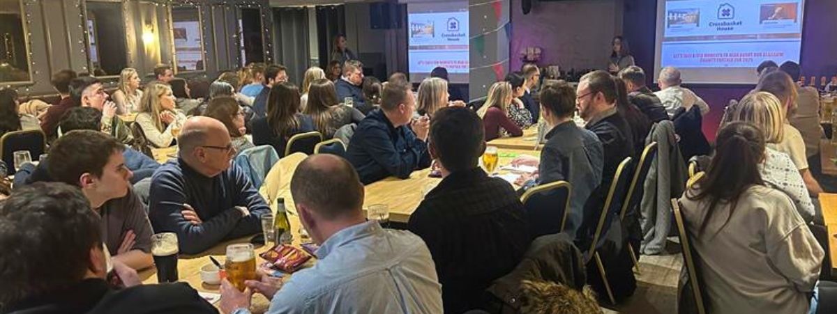 Glasgow office raise thousands for Crossbasket House with bumper quiz night