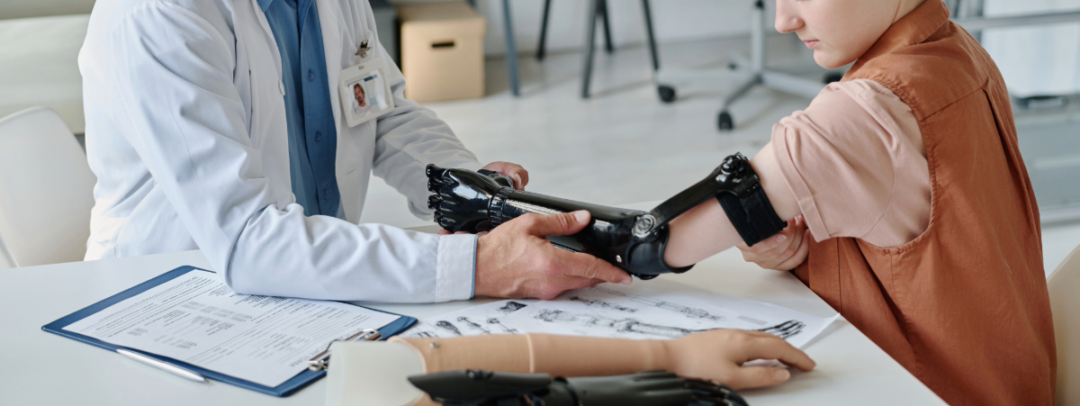 Doctor assisting amputee with proper prosthetic fitting