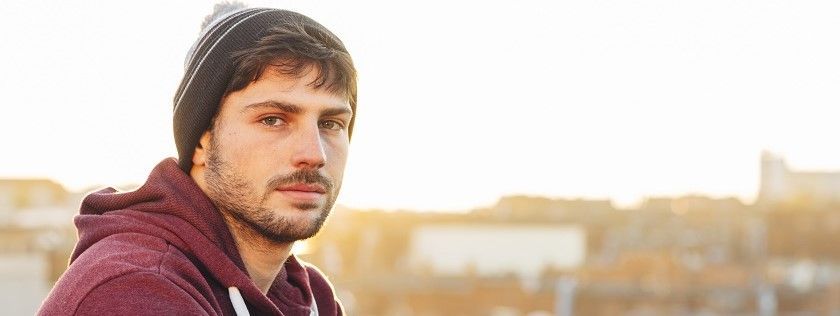 Man looking thoughtful to camera