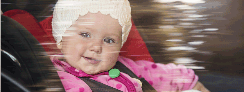 Child in car seat looking out window
