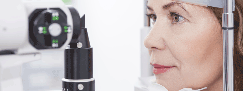 Woman getting eyes examined