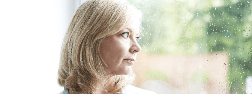 Woman looking out of window