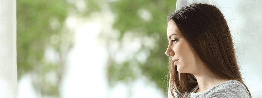 Woman Looking Out Window