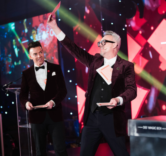 Quantum Mind Reader David Zambuka with top broadvaster Des Clarke on stage at the 2025 Winter Dinner Dance.