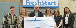 Cheque handover outside FreshStart