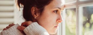 Woman looking out of window