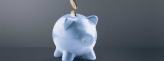 Blue piggy bank with coins going in