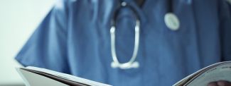 Doctor looking at notes