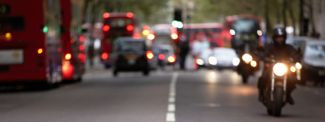 Cars, buses and motorbike traffic in town