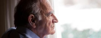 Older Man Looking Out Window
