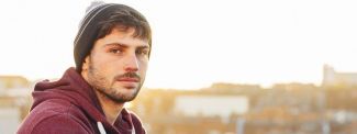 Man looking thoughtful to camera