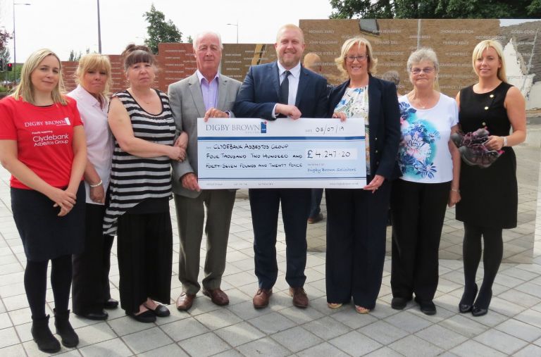 Digby Brown present cheque to the team at Clydebank Asbestos Group