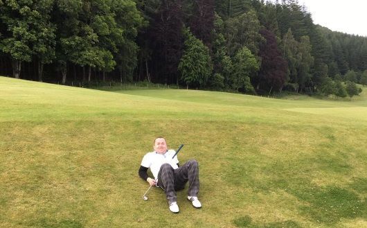 David McGowan, Inverness Solicitor, having a rest on the golf course as part of the Longest Day Golf Challenge for Macmillan