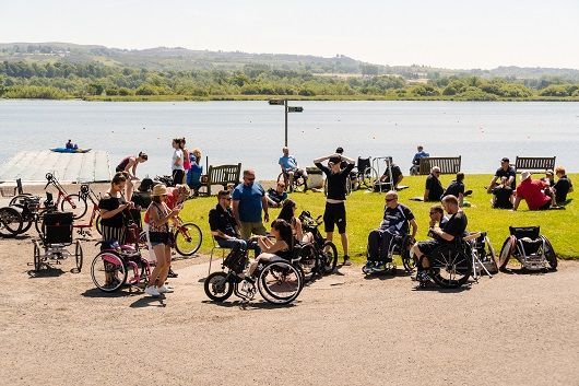 SIS guests enjoying handbiking in the sunshine